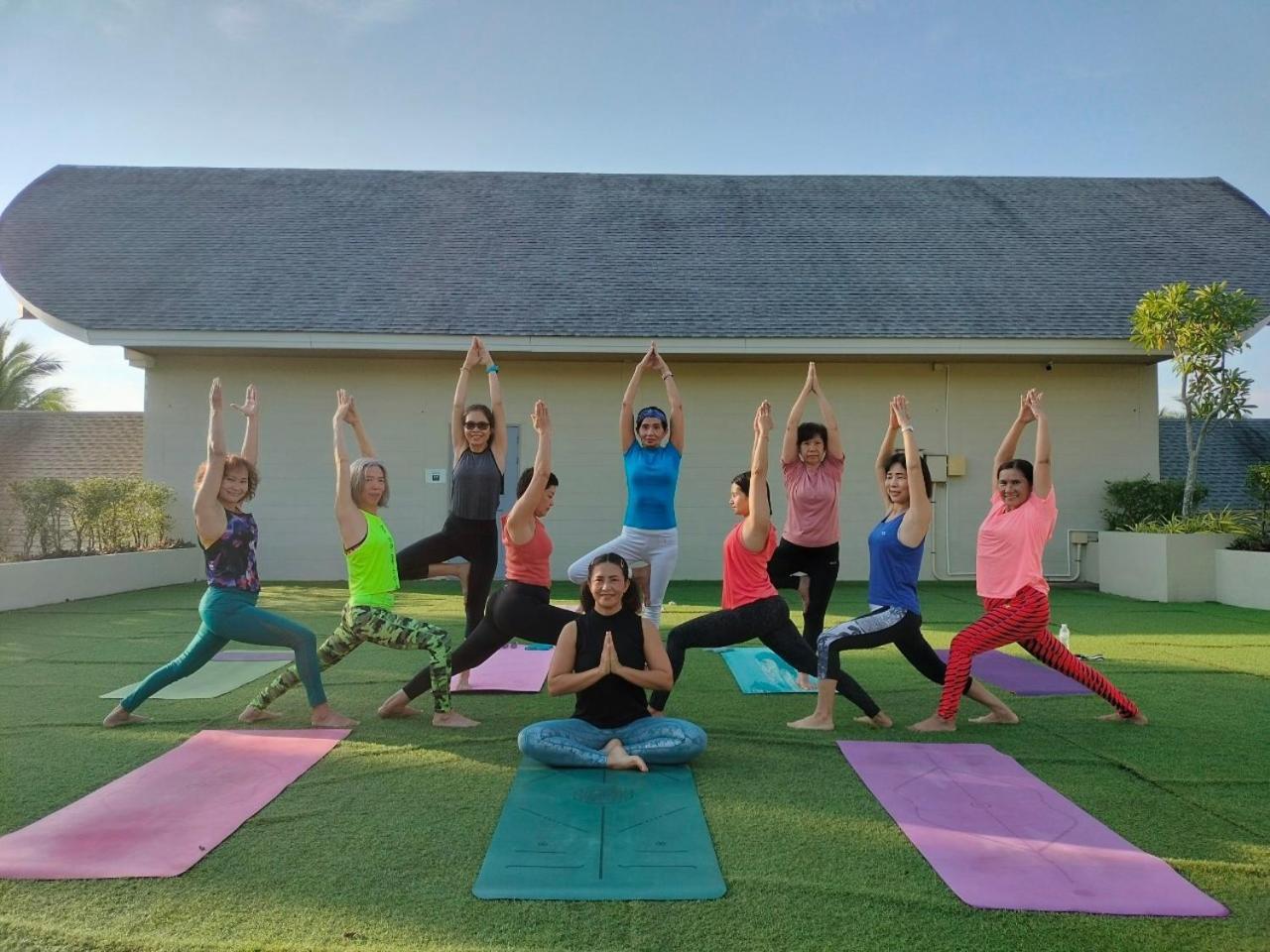 Craft Resort & Villas, Phuket Town Exterior photo A yoga class in progress