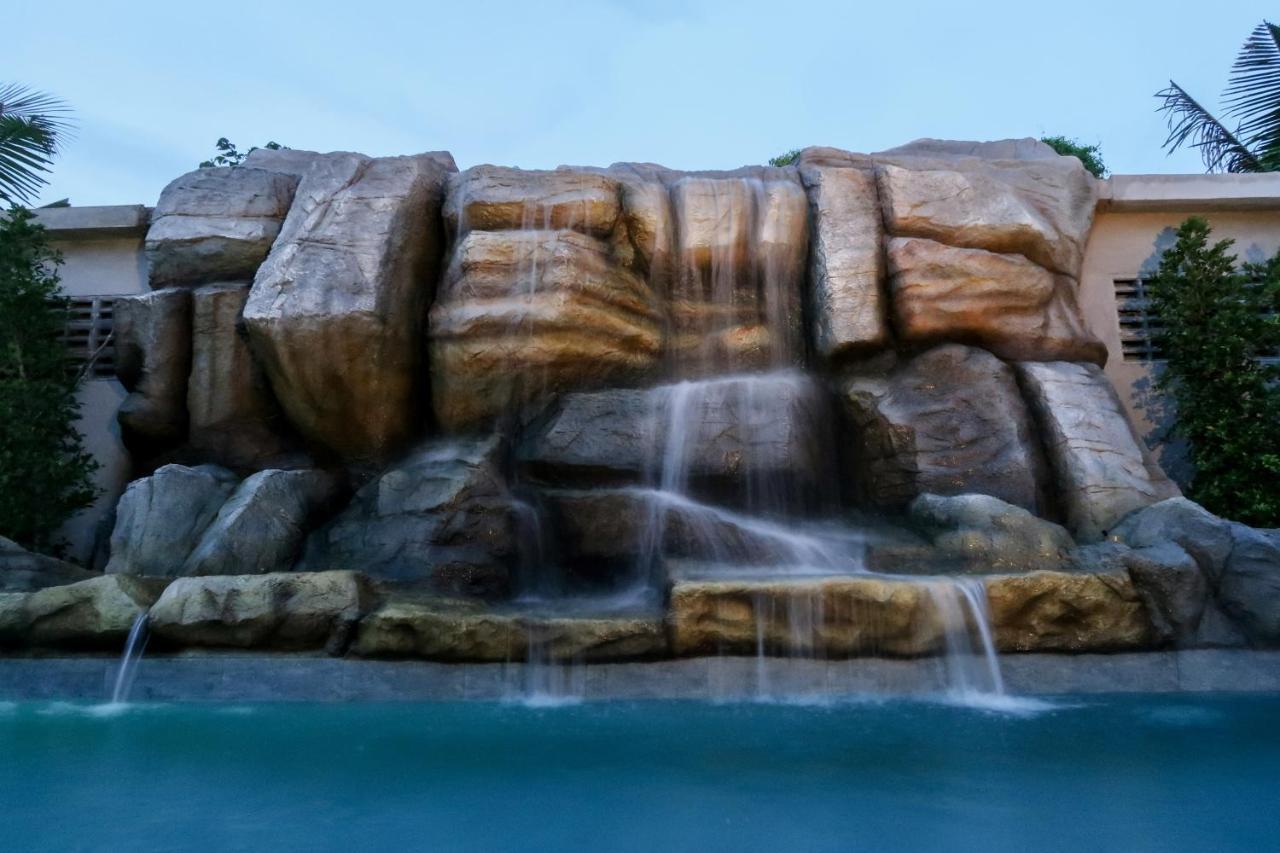 Craft Resort & Villas, Phuket Town Exterior photo The waterfall at the resort